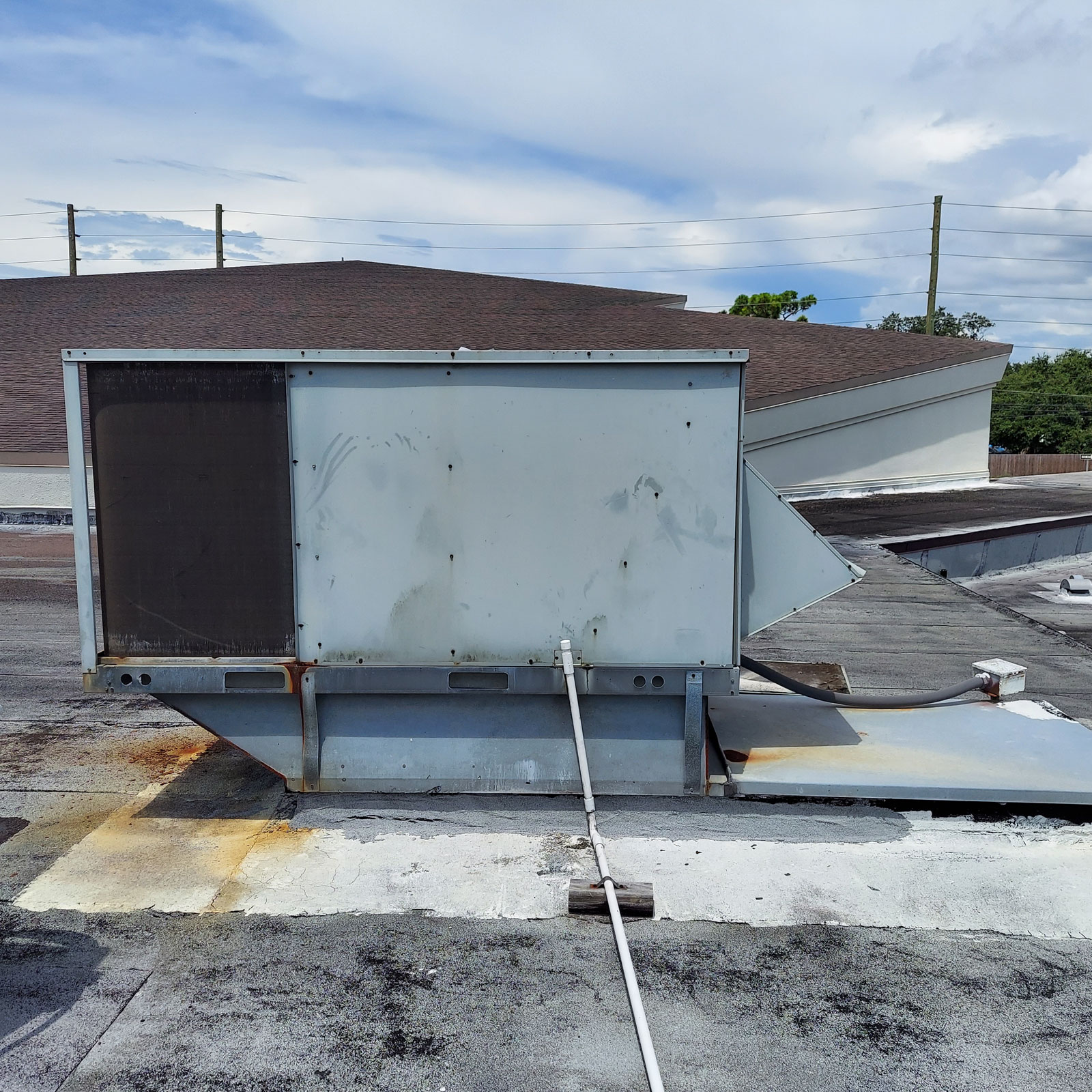 Old commercial rooftop HVAC unit before replacement